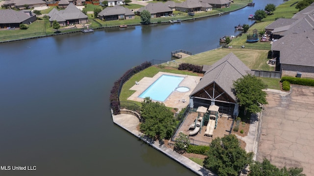 drone / aerial view with a residential view and a water view