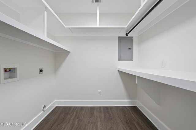 laundry room featuring baseboards, electric panel, laundry area, hookup for a washing machine, and hookup for an electric dryer