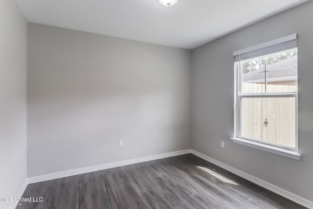 13262 Turtle Creek Pkwy, Gulfport, MS 39503 - unfurnished room with dark wood-style flooring and baseboards