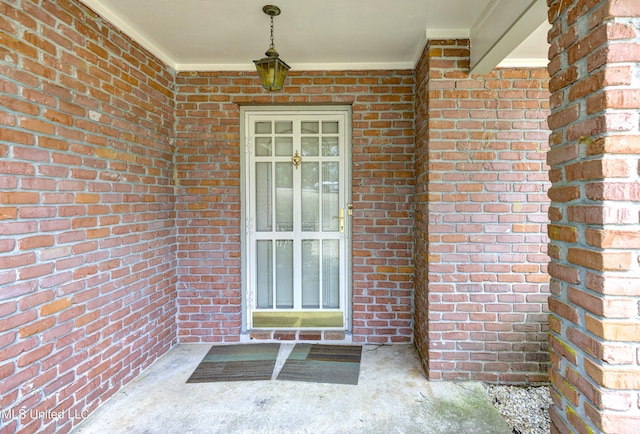 911 Newitt Vick Dr, Vicksburg, MS 39183 - doorway to property with brick siding and covered porch