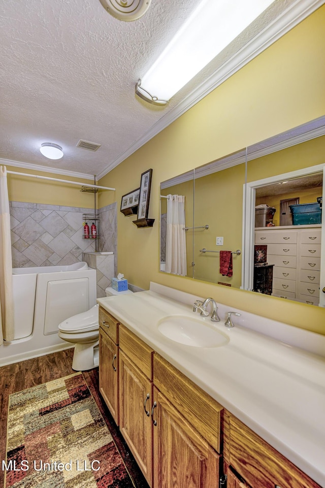 911 Newitt Vick Dr, Vicksburg, MS 39183 - full bath with a textured ceiling, vanity, toilet, crown molding, and wood finished floors