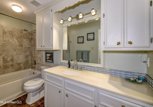 911 Newitt Vick Dr, Vicksburg, MS 39183 - full bathroom featuring toilet, vanity, tub / shower combination, and wood finished floors