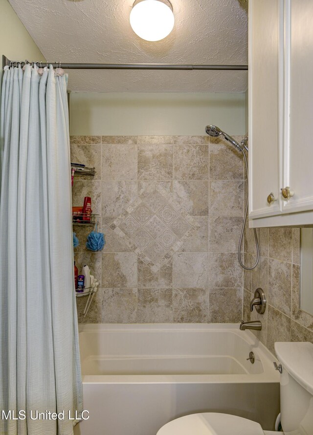 911 Newitt Vick Dr, Vicksburg, MS 39183 - full bathroom featuring toilet, shower / tub combo, and a textured ceiling