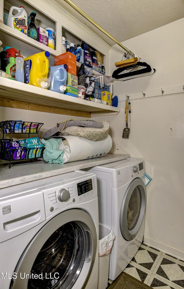 911 Newitt Vick Dr, Vicksburg, MS 39183 - washroom featuring washing machine and clothes dryer and tile patterned floors