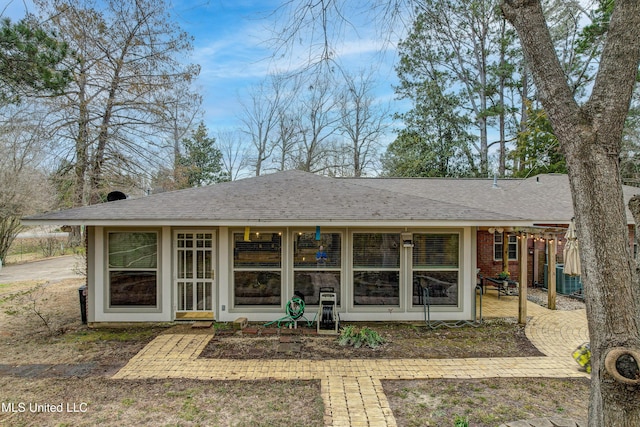 911 Newitt Vick Dr, Vicksburg, MS 39183 - rear view of property with roof with shingles, brick siding, and central AC unit
