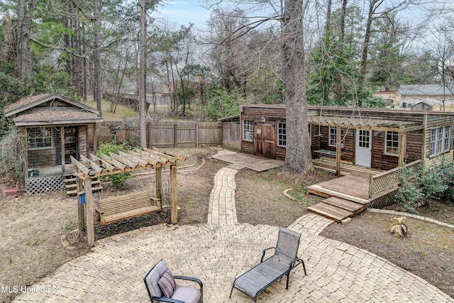 911 Newitt Vick Dr, Vicksburg, MS 39183 - view of yard featuring a wooden deck, a patio, and an outdoor structure