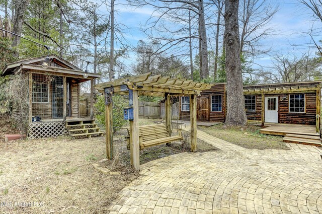 911 Newitt Vick Dr, Vicksburg, MS 39183 - view of yard with a pergola, a wooden deck, and a patio