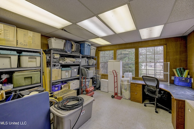911 Newitt Vick Dr, Vicksburg, MS 39183 - home office with a paneled ceiling, light flooring, and wooden walls