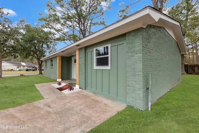 view of outbuilding with a lawn