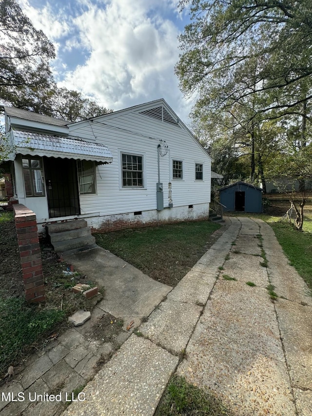 exterior space with a storage shed