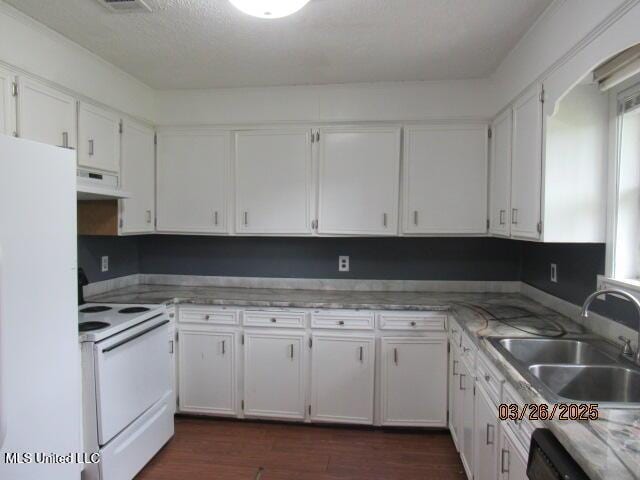 kitchen featuring a sink, white cabinets, under cabinet range hood, and white appliances