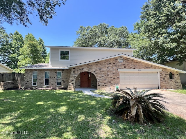 2418 Northridge Dr, Gautier, MS 39553 - view of front facade featuring brick siding, an attached garage, and driveway