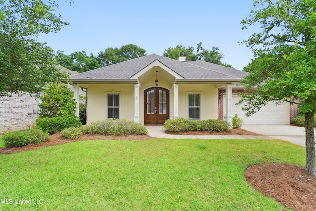 11541 Briarstone Pl, Gulfport, MS 39503 - view of front of property featuring french doors, concrete driveway, a front yard, an attached garage, and a chimney