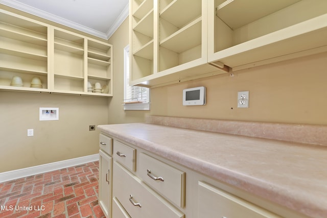 11541 Briarstone Pl, Gulfport, MS 39503 - laundry area featuring crown molding, brick floors, hookup for a washing machine, and hookup for an electric dryer