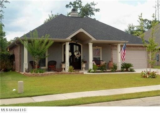 11541 Briarstone Pl, Gulfport, MS 39503 - ranch-style house featuring a garage, a front yard, and driveway
