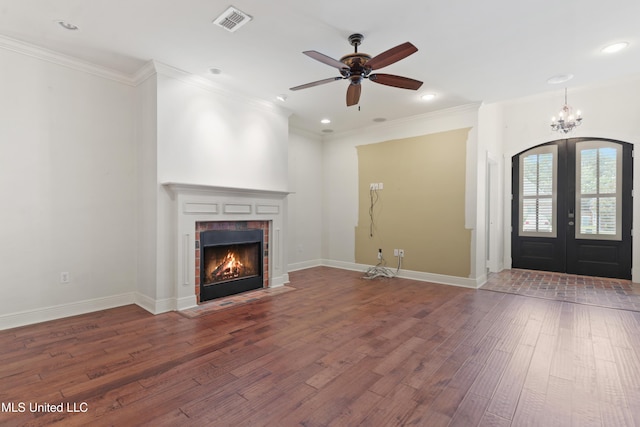11541 Briarstone Pl, Gulfport, MS 39503 - unfurnished living room with wood finished floors, ceiling fan, a fireplace, french doors, and ornamental molding