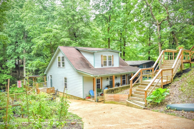 3670 Glen Artney Cv, Hernando, MS 38632 - view of front of house with stairway, concrete driveway, a shingled roof, a porch, and a deck