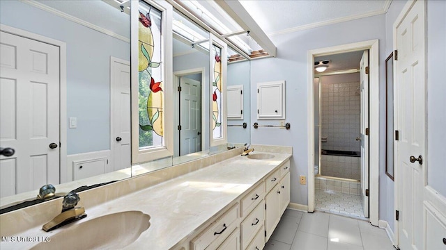 555 Rusk Dr, Brandon, MS 39047 - bathroom featuring double vanity, a tile shower, ornamental molding, and tile patterned flooring