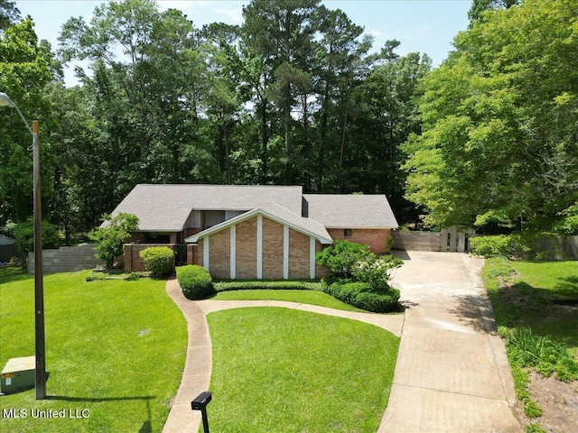 555 Rusk Dr, Brandon, MS 39047 - view of front facade featuring driveway and brick siding