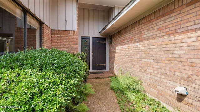 555 Rusk Dr, Brandon, MS 39047 - entrance to property with board and batten siding and brick siding