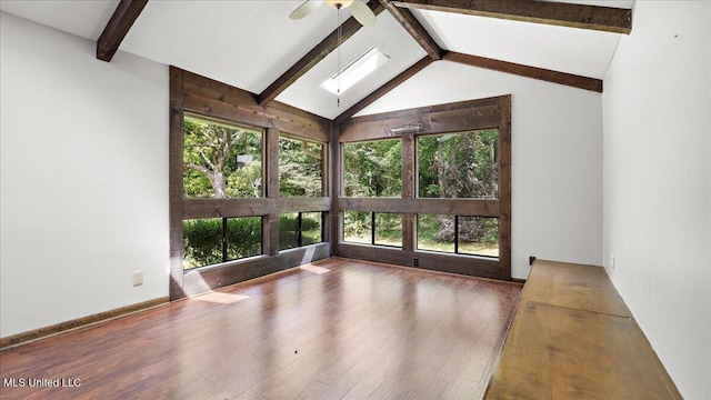 555 Rusk Dr, Brandon, MS 39047 - unfurnished living room with healthy amount of natural light, a skylight, a ceiling fan, and wood finished floors