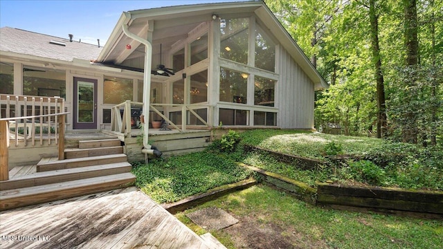 555 Rusk Dr, Brandon, MS 39047 - rear view of property with a sunroom and ceiling fan