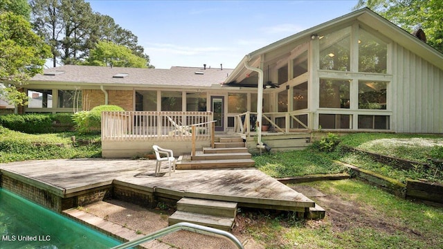 555 Rusk Dr, Brandon, MS 39047 - back of property with a deck and a sunroom