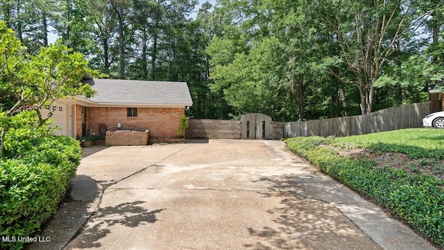 555 Rusk Dr, Brandon, MS 39047 - view of patio / terrace featuring a gate and driveway