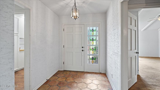 555 Rusk Dr, Brandon, MS 39047 - entrance foyer with a textured wall and a chandelier
