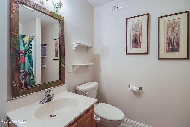 515 Third St Unit 5A, Bay Saint Louis, MS 39520 - full bathroom featuring visible vents, toilet, and vanity