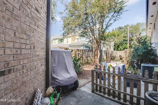 515 Third St Unit 5A, Bay Saint Louis, MS 39520 - view of patio / terrace with fence and area for grilling