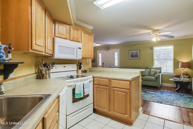 515 Third St Unit 5A, Bay Saint Louis, MS 39520 - kitchen with a sink, white appliances, a peninsula, open floor plan, and ornamental molding
