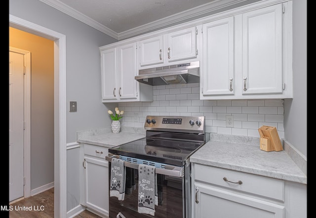 kitchen featuring stainless steel range with electric cooktop, white cabinetry, ornamental molding, and tasteful backsplash