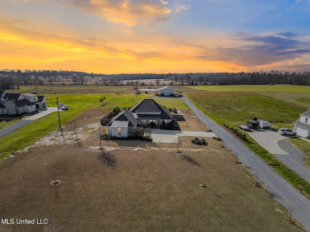 birds eye view of property featuring a rural view