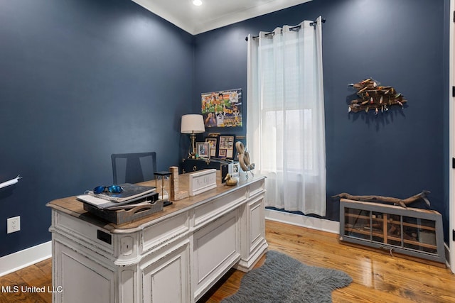 home office with wood finished floors and baseboards