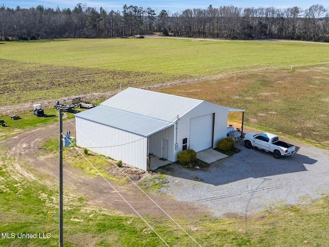 birds eye view of property with a rural view