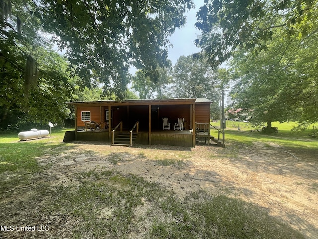43 White Oak Dr, Natchez, MS 39120 - back of house featuring an exterior structure and an outbuilding