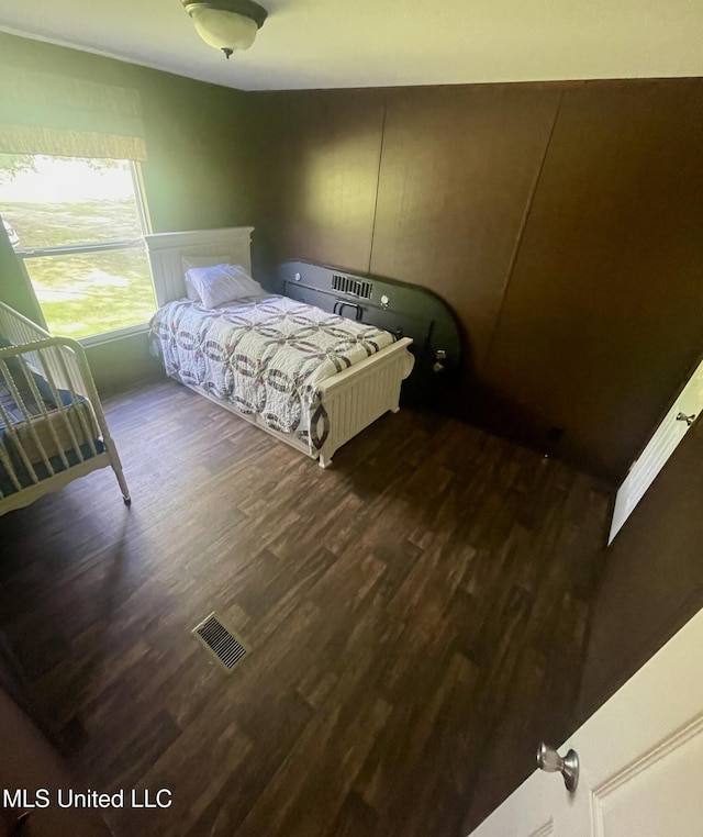 43 White Oak Dr, Natchez, MS 39120 - bedroom featuring wood finished floors and a decorative wall