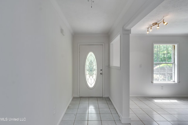 354 Lakeway Dr, Brandon, MS 39047 - entrance foyer with crown molding, light tile patterned floors, and baseboards