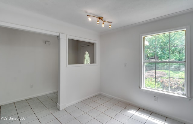 354 Lakeway Dr, Brandon, MS 39047 - spare room with plenty of natural light, light tile patterned floors, and baseboards