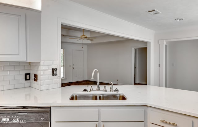 354 Lakeway Dr, Brandon, MS 39047 - kitchen featuring a sink, dishwashing machine, tasteful backsplash, white cabinetry, and a ceiling fan