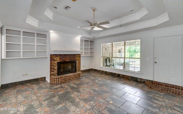354 Lakeway Dr, Brandon, MS 39047 - unfurnished living room with a tray ceiling, ornamental molding, ceiling fan, a fireplace, and baseboards