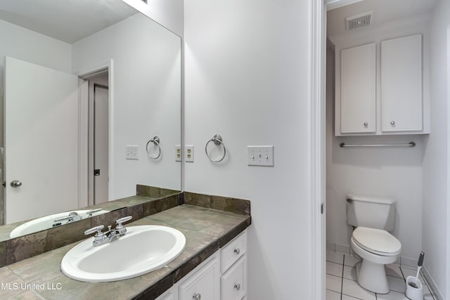 354 Lakeway Dr, Brandon, MS 39047 - bathroom featuring vanity, toilet, tile patterned floors, and baseboards