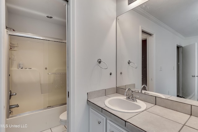 354 Lakeway Dr, Brandon, MS 39047 - bathroom featuring vanity, shower / bath combination with glass door, toilet, crown molding, and tile patterned flooring