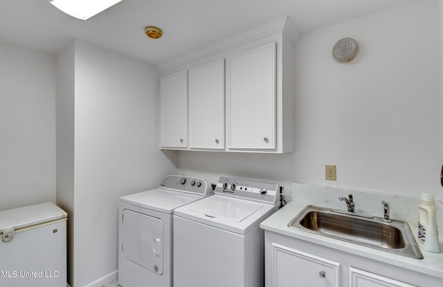 354 Lakeway Dr, Brandon, MS 39047 - washroom with washing machine and clothes dryer and cabinet space