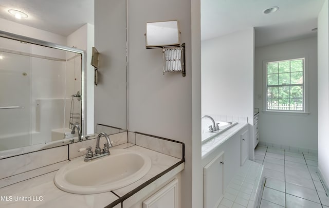 354 Lakeway Dr, Brandon, MS 39047 - full bathroom featuring a bathtub, vanity, an enclosed shower, and tile patterned flooring