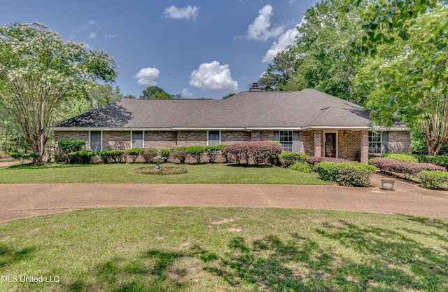 354 Lakeway Dr, Brandon, MS 39047 - ranch-style house with brick siding, a front yard, a chimney, and a shingled roof