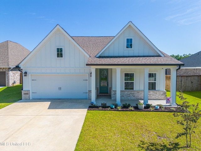 12035 Schooner, Biloxi, MS 39532 - modern farmhouse featuring board and batten siding, roof with shingles, brick siding, covered porch, and driveway