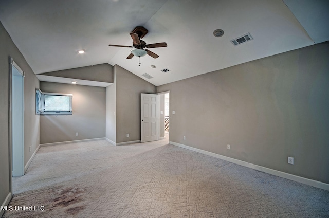 interior space with lofted ceiling, light carpet, and ceiling fan