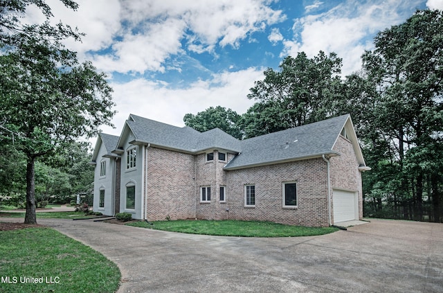 view of home's exterior with a yard and a garage